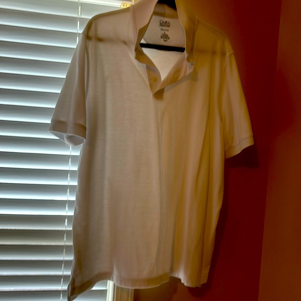 White polo type short sleeve shirt